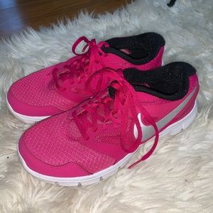 Pink and sliver Nike athletic shoes
